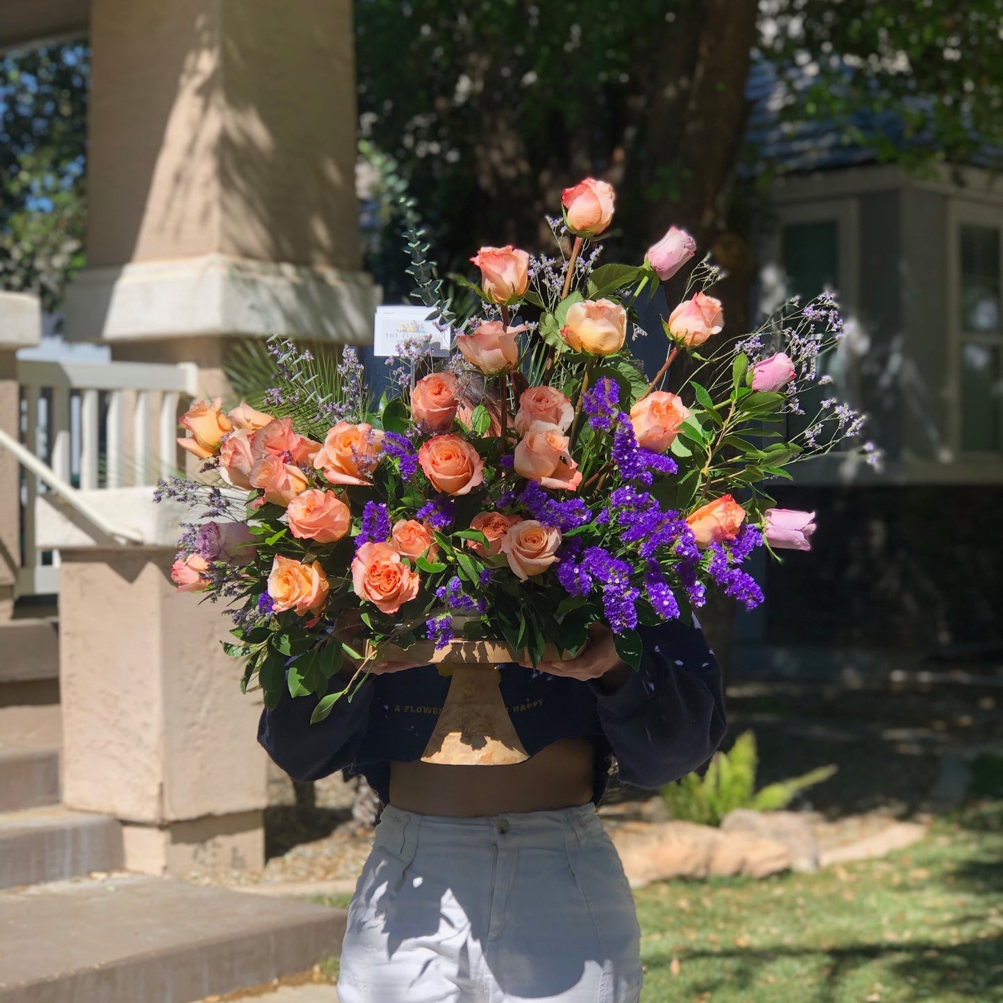 Elegant rose arrangement in unique curved moon shape