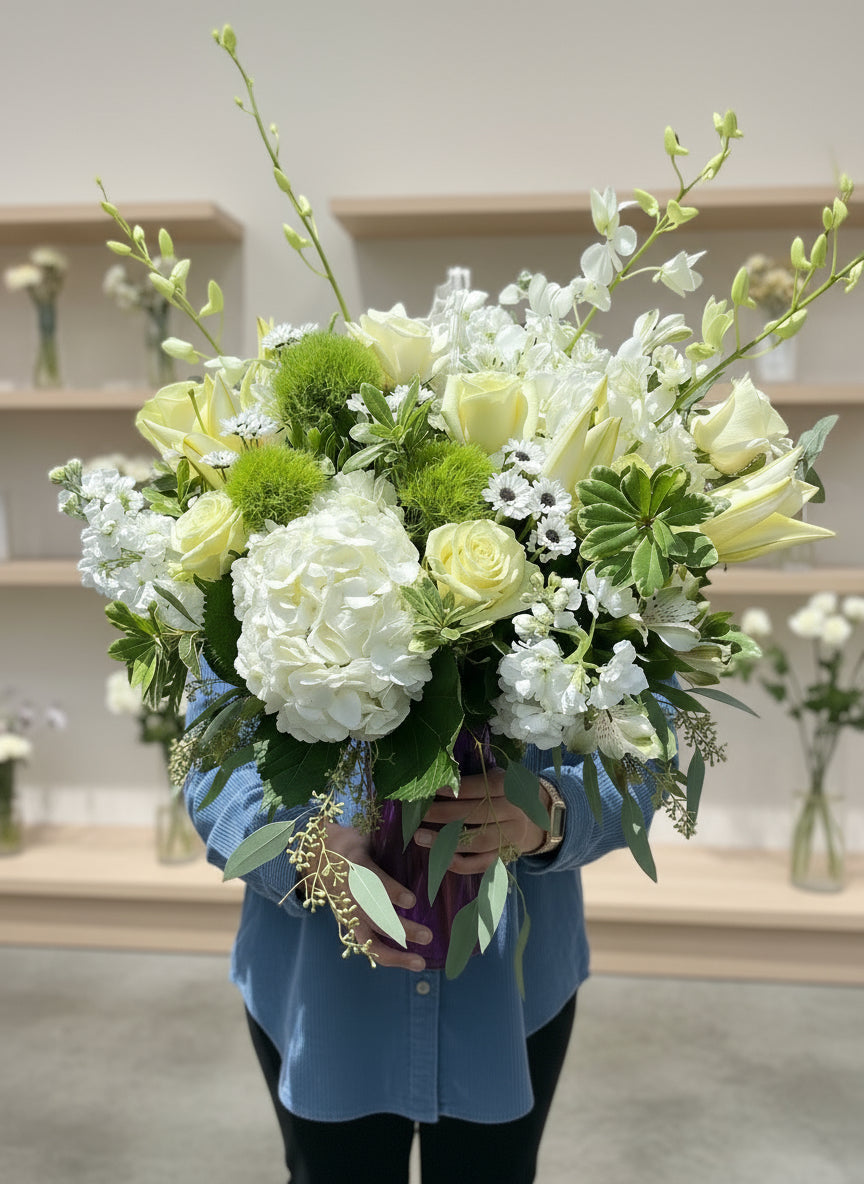 Classic White and Green flowers displayed in a in a vase in a modern stylish and elegant floral display.
Available for delivery in Phoenix area, Gilbert, Mesa, Chandler, Tempe, Queen Creek