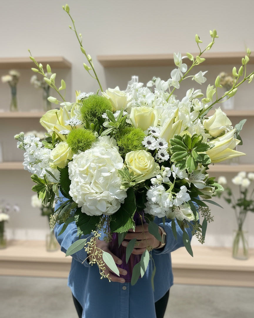 Classic White and Green flowers displayed in a in a vase in a modern stylish and elegant floral display.
Available for delivery in Phoenix area, Gilbert, Mesa, Chandler, Tempe, Queen Creek