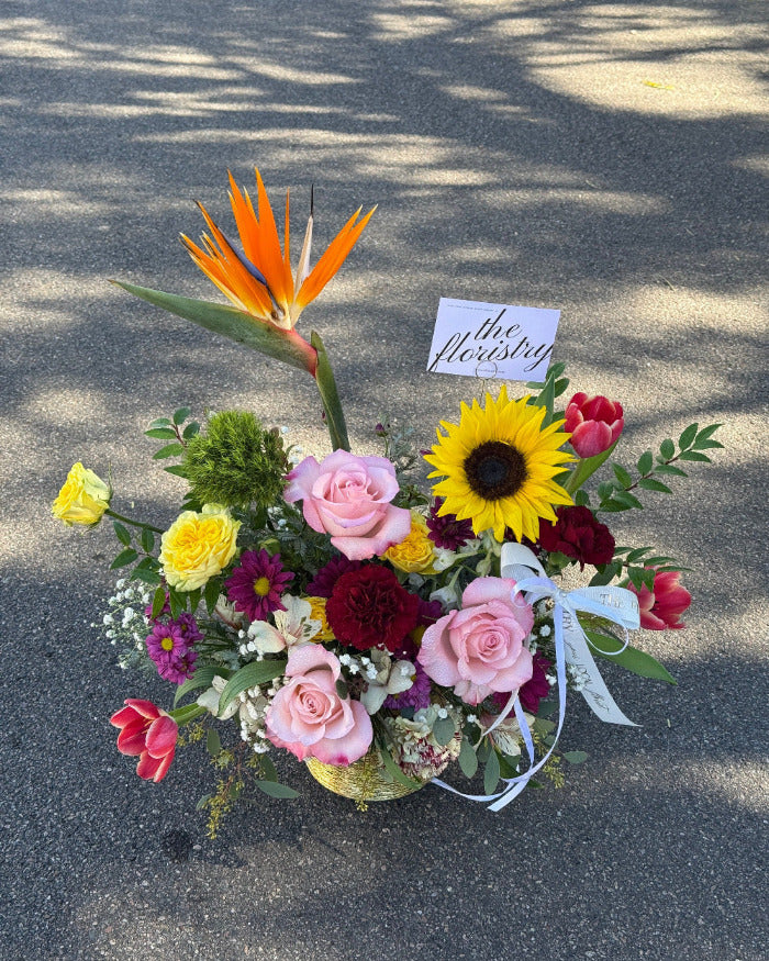 Elegant spring mix floral centerpiece designed with fresh blooms and balanced textures for everyday and seasonal décor.