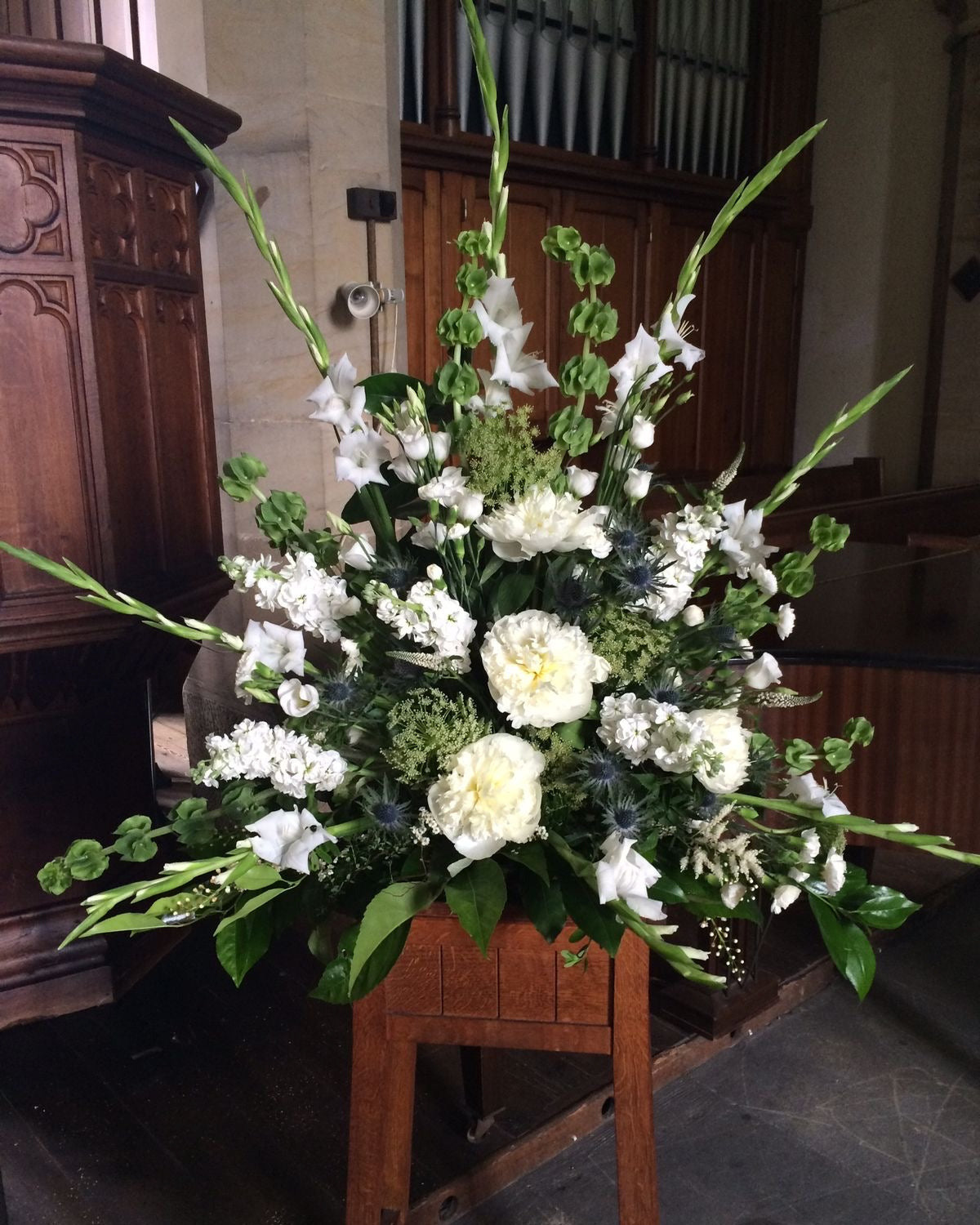 Heartfelt Sympathies White Green Funeral Standing Arrangement, available for same day delivery in Gilbert, Queen Creek, Chandler, Mesa, Tempe, Phoenix Arizona