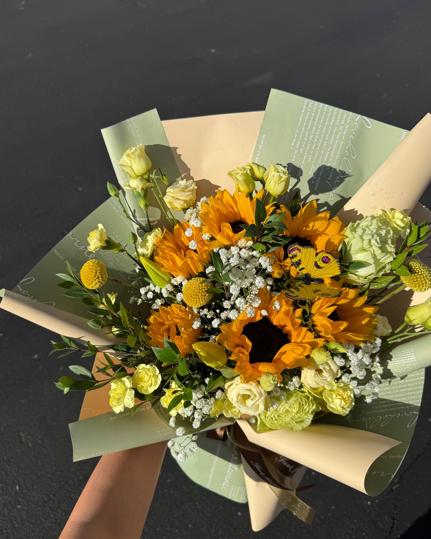 Our Yellow Mix Bouquet combines radiant blooms like roses, sunflowers, and seasonal accents