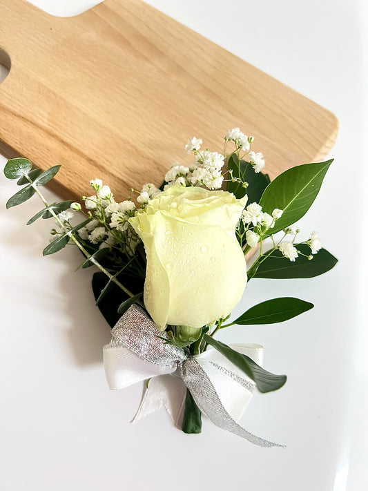 Corsage and Single rose boutonnière with greenery accent.