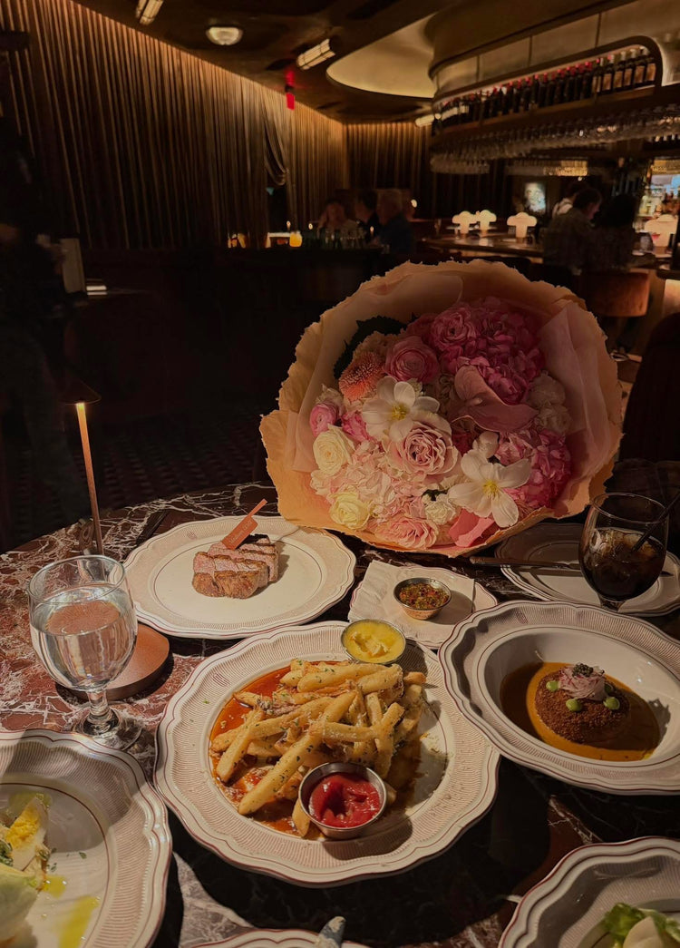 Designer luxury bouquet with rich color tones, premium blooms, and an elevated, statement making presentation.