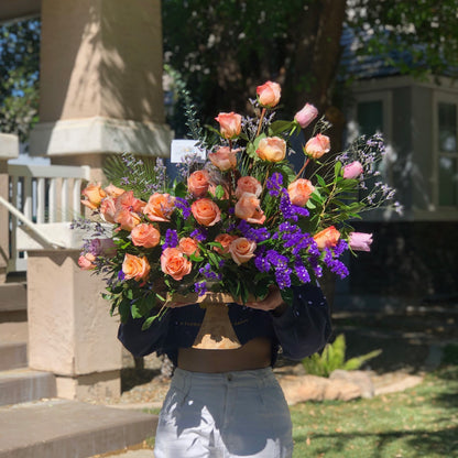 Elegant rose arrangement in unique curved moon shape