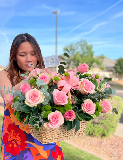 Romantic red rose basket arrangement with eucalyptus, daises