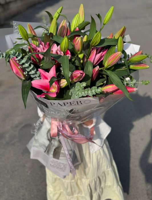 	Fresh-cut lilies bouquet symbolizing purity and love, ideal for birthdays or anniversaries.