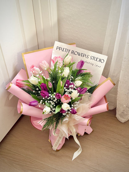 Beautiful Tulips Kisses bouquet with soft tulips and white baby breath, thoughtfully arranged for delivery. A fresh and elegant gift for any occasion.