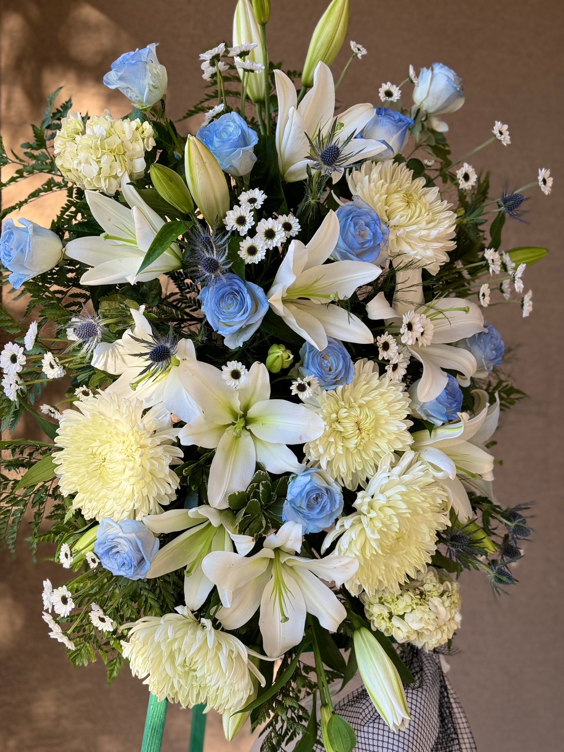 Blue & White Funeral Standing Spray
