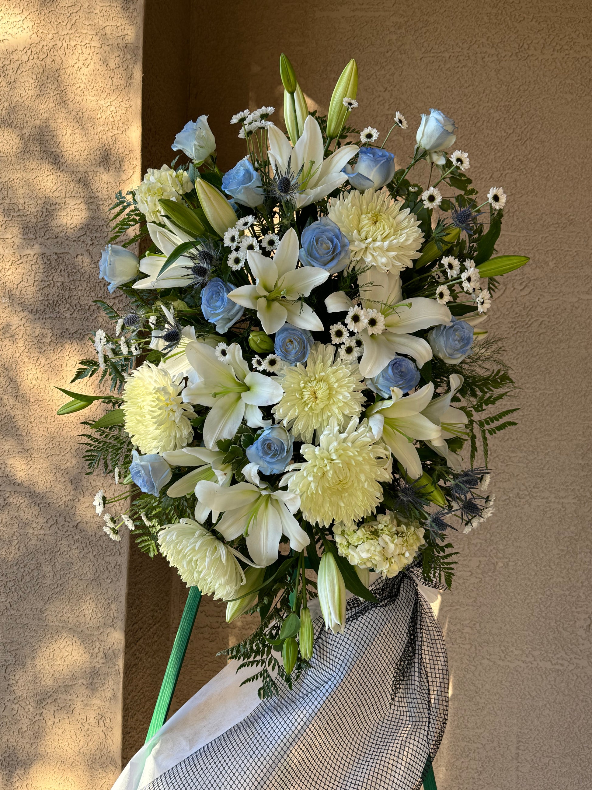 Blue & White Funeral Standing Spray
