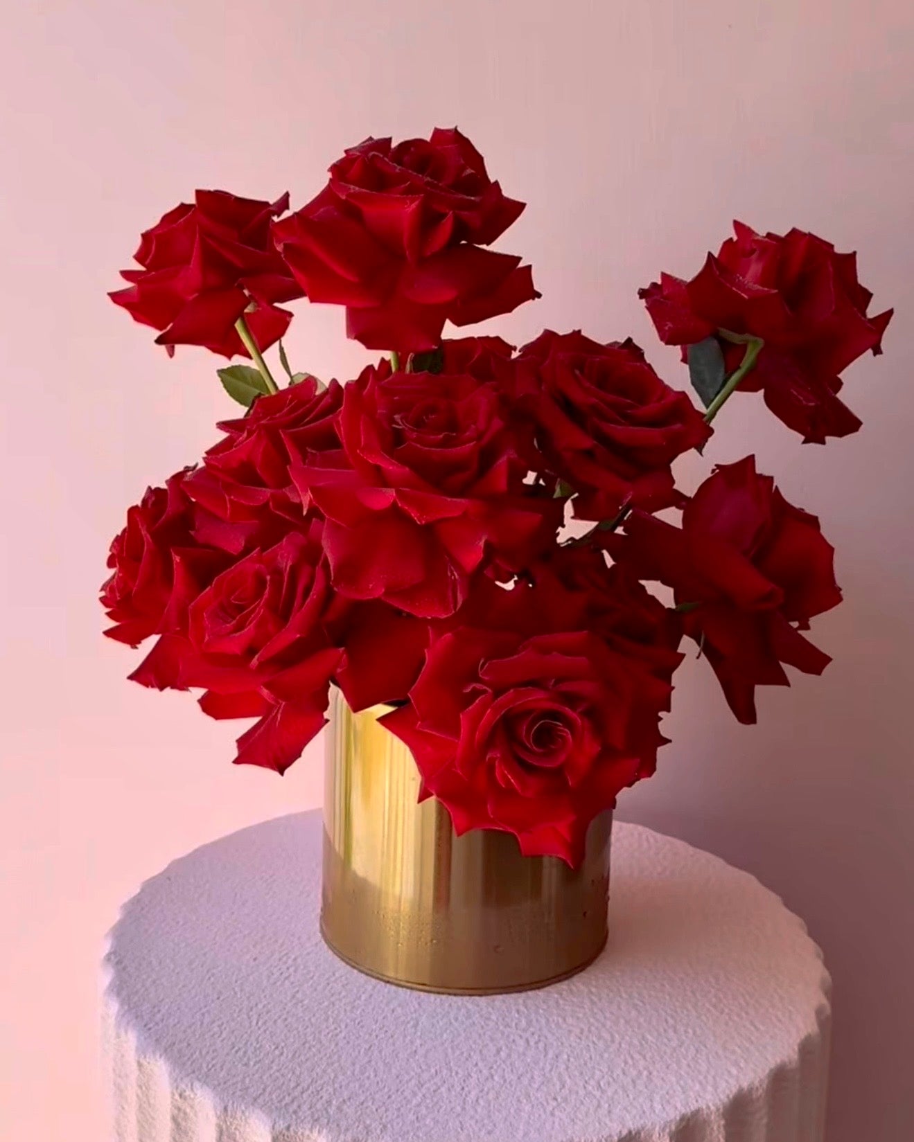 Elegant luxury centerpiece featuring bold red roses in a soft, flowing freestyle design delivery in Queen Creek, AZ