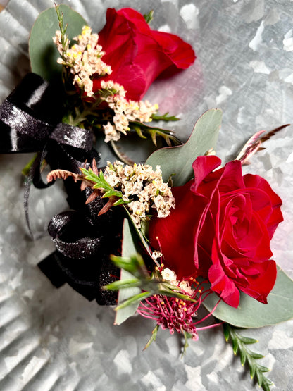 Elegant red roses corsage and boutonniere for prom night
