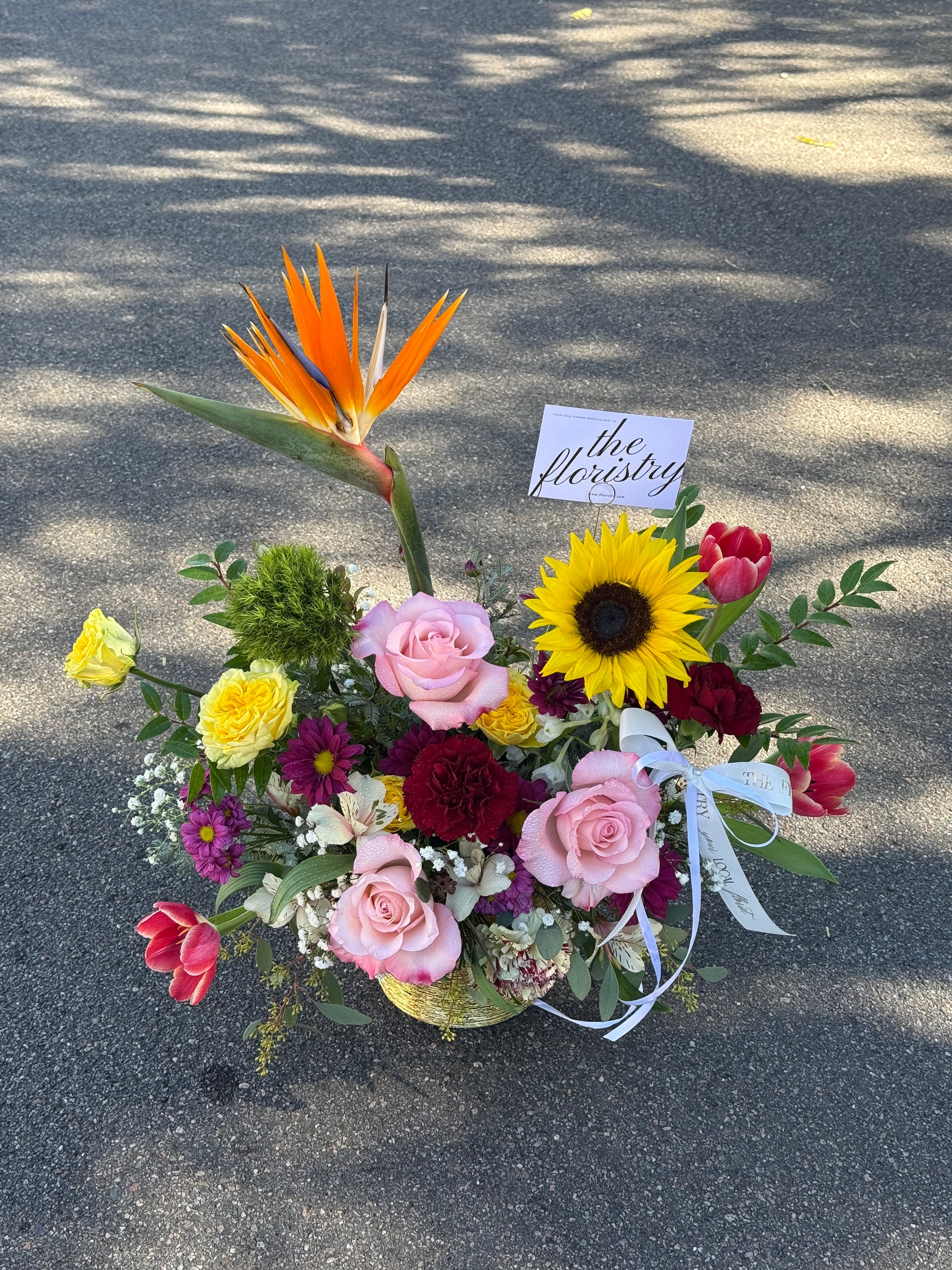 Elegant spring mix floral centerpiece designed with fresh blooms and balanced textures for everyday and seasonal décor.
