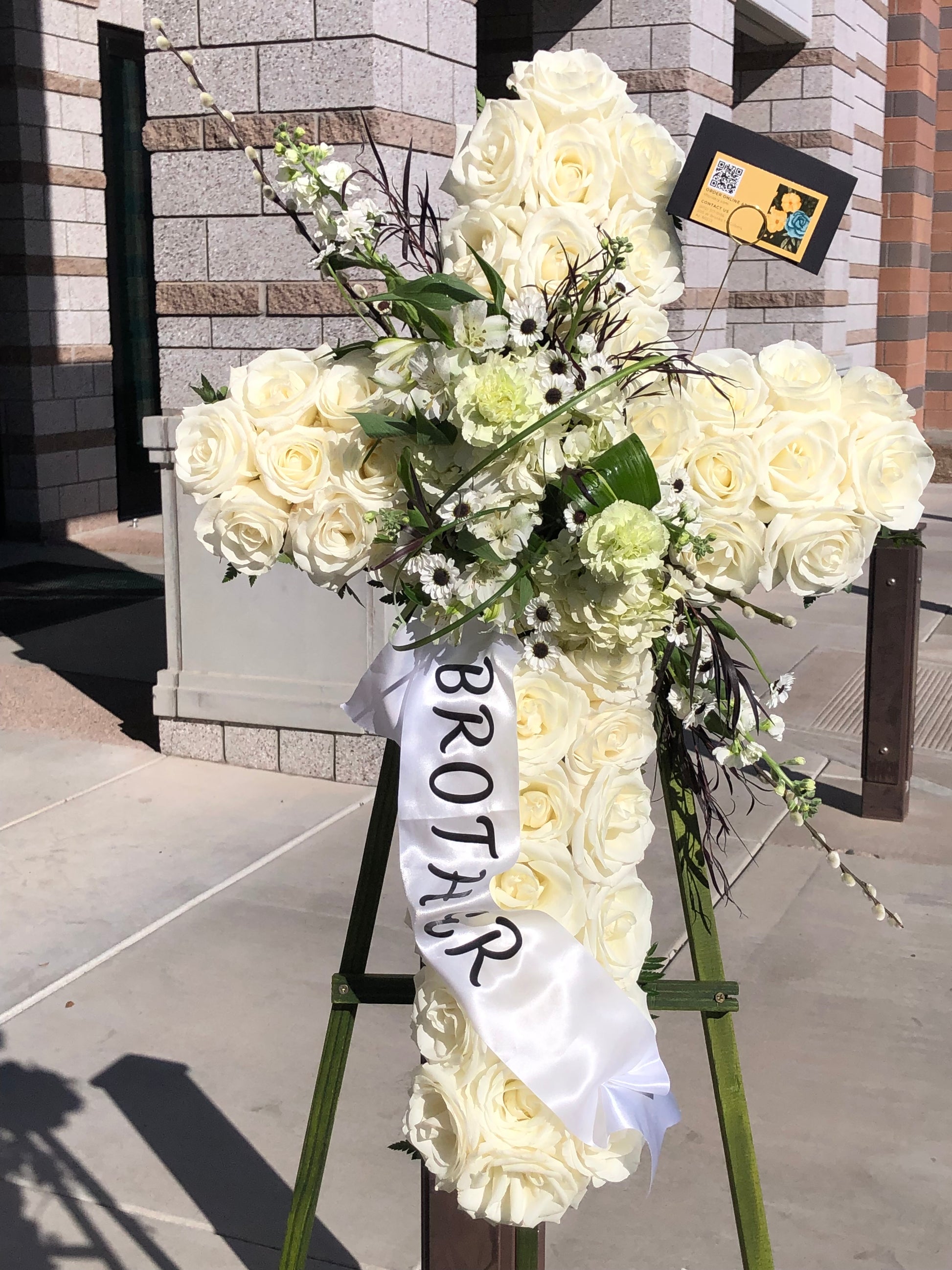 Elegant funeral cross flower stand for memorial services with local delivery in Gilbert, Chandler, Tempe, Queen Creek, and Mesa Arizona.