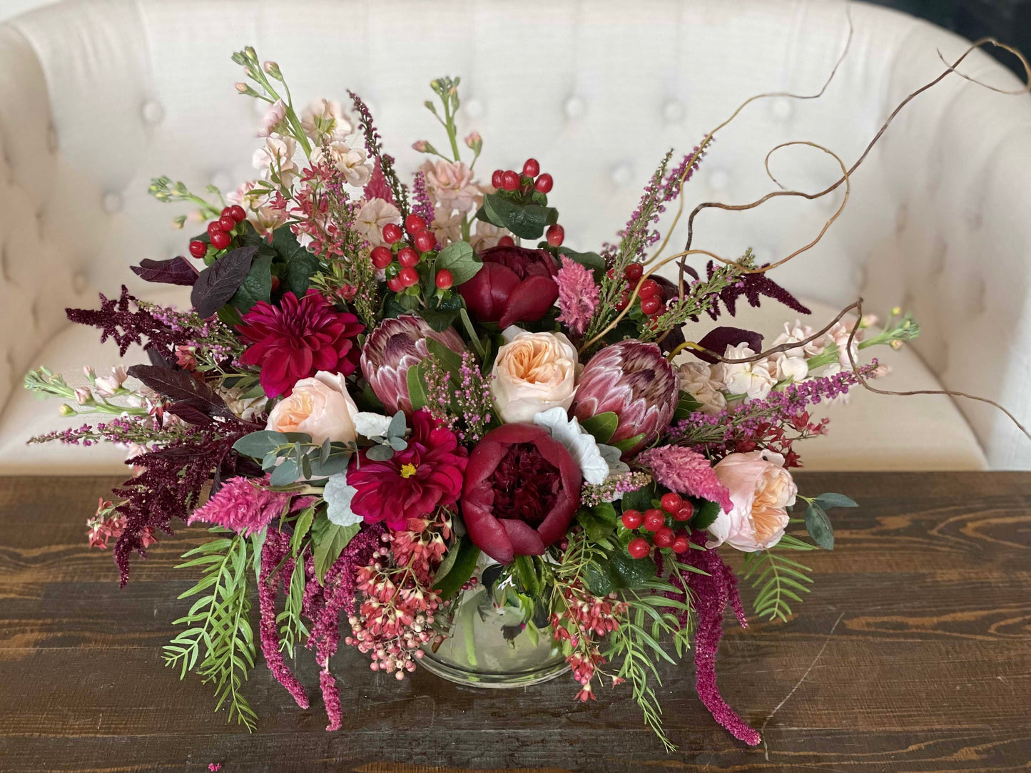 Gorgeous luxury burgundy flower arrangement with peonies, proteas, available for same day flower delivery in Gilbert, Queen Creek.
