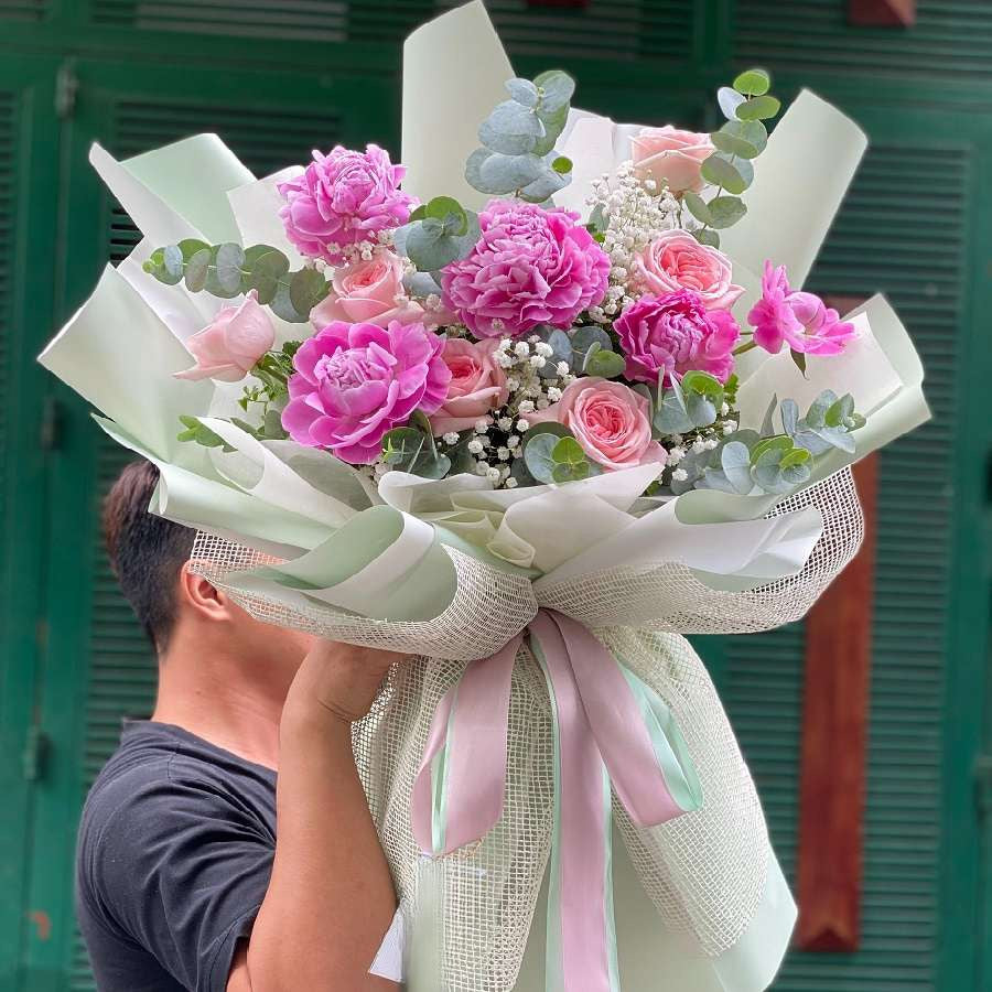Rich Fuchsia Pink Peony Flower this Mother's Day week.
 The bouquet features five or ten peonies with blushing roses and delicate baby's breath, a charming blend of beauty and grace.