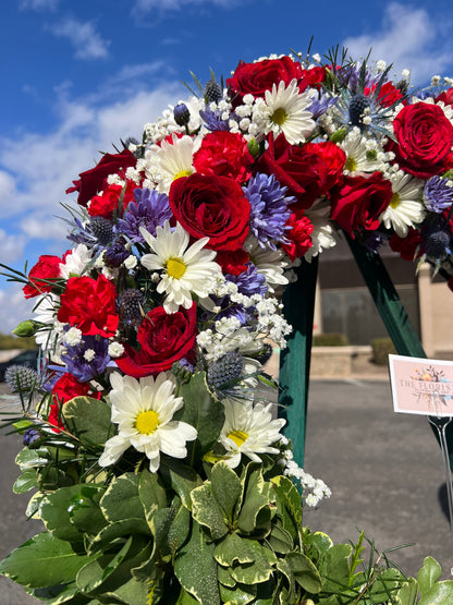 Looking for a patriotic red, white, and blue flower stand for delivery in Phoenix?