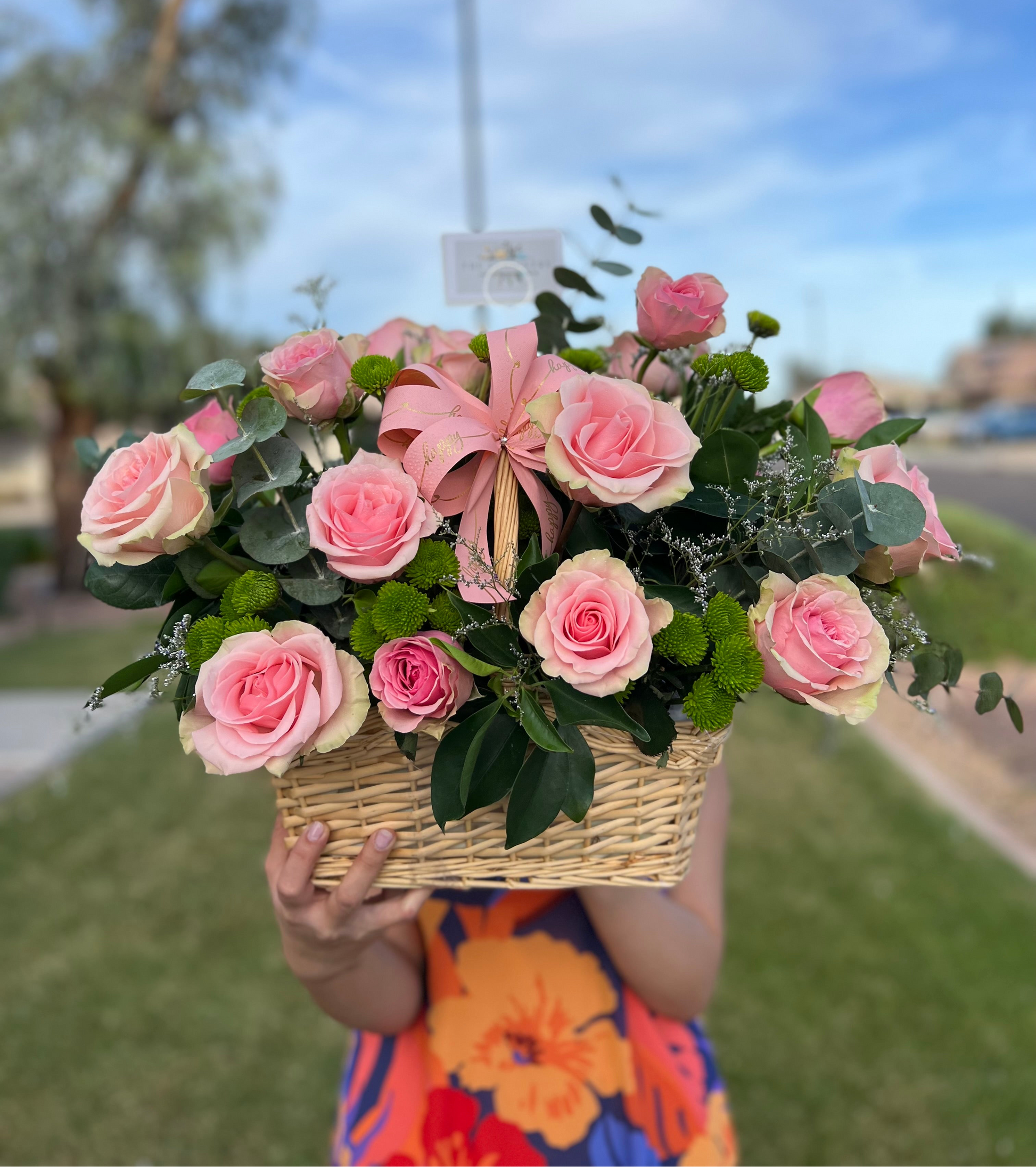 Elegant woven basket with lush red roses for gifting