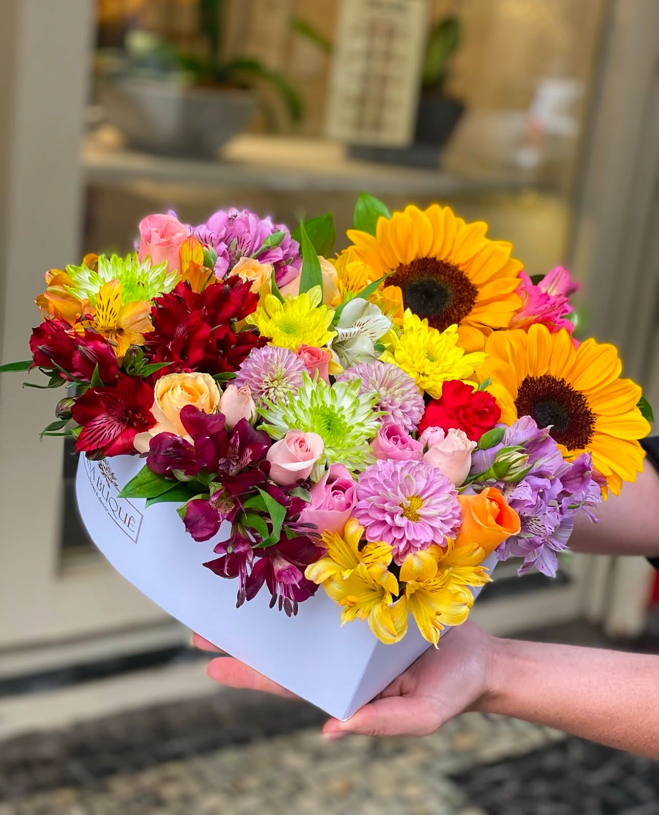 Spring Color Flowers Heart Box, beautiful vibrant blooms, available for same day flower delivery in Gilbert, Queen Creek, Mesa, Chandler Arizona.