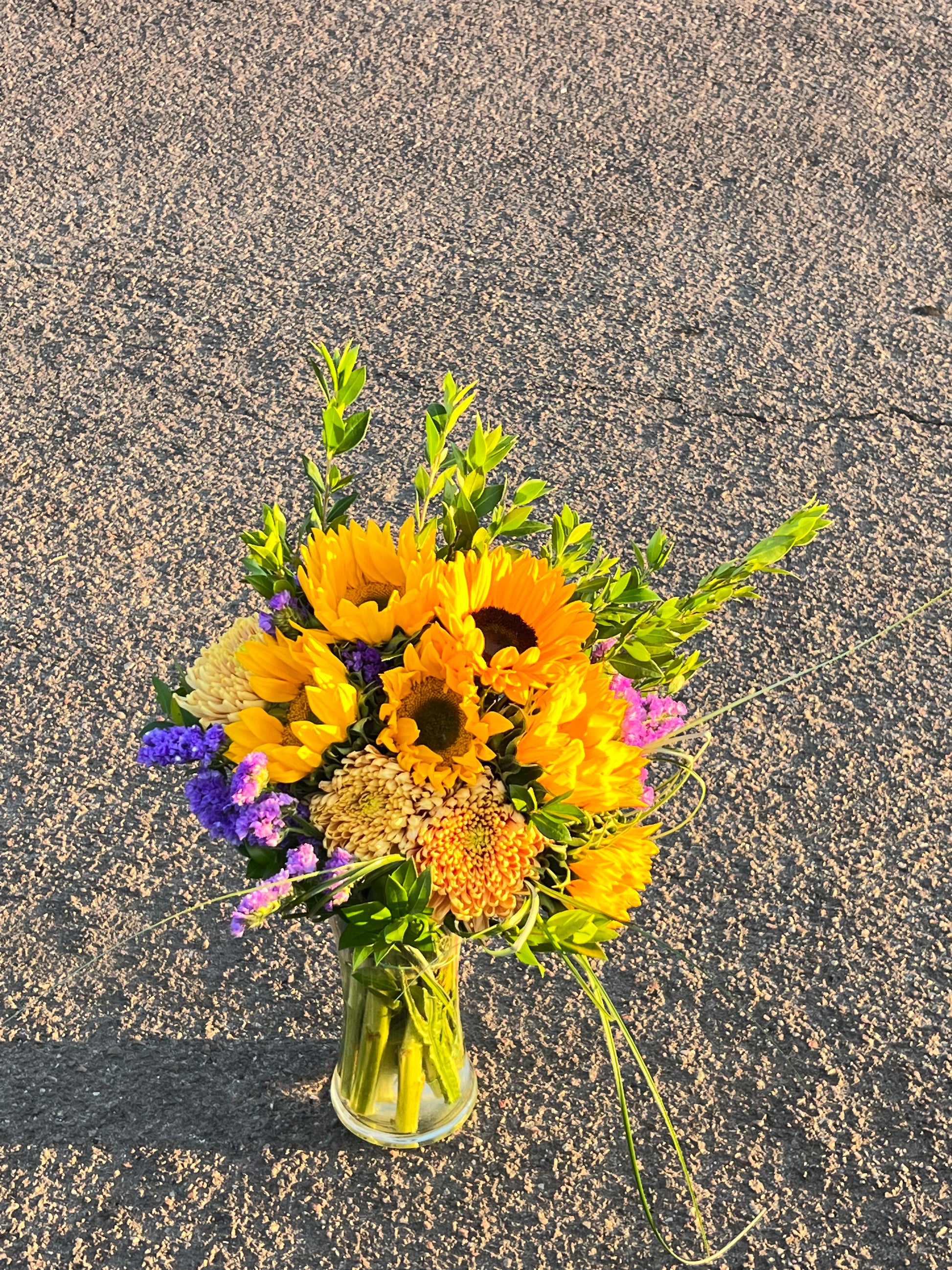 Bright and radiant, in a stylish one-faced design. Symbolizing warmth, happiness, and positivity, this bouquet is perfect for bringing sunshine into any space. 