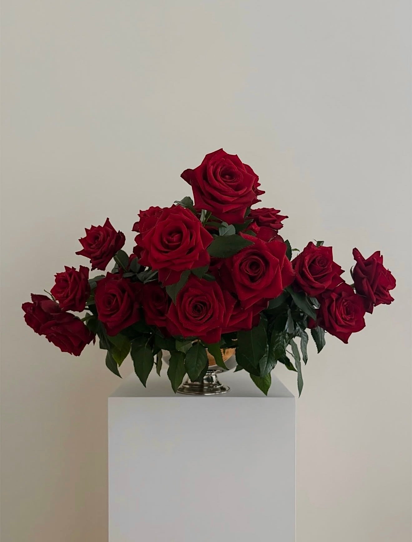Luxury red rose freestyle centerpiece with cloud-like shape, elegant and modern floral design