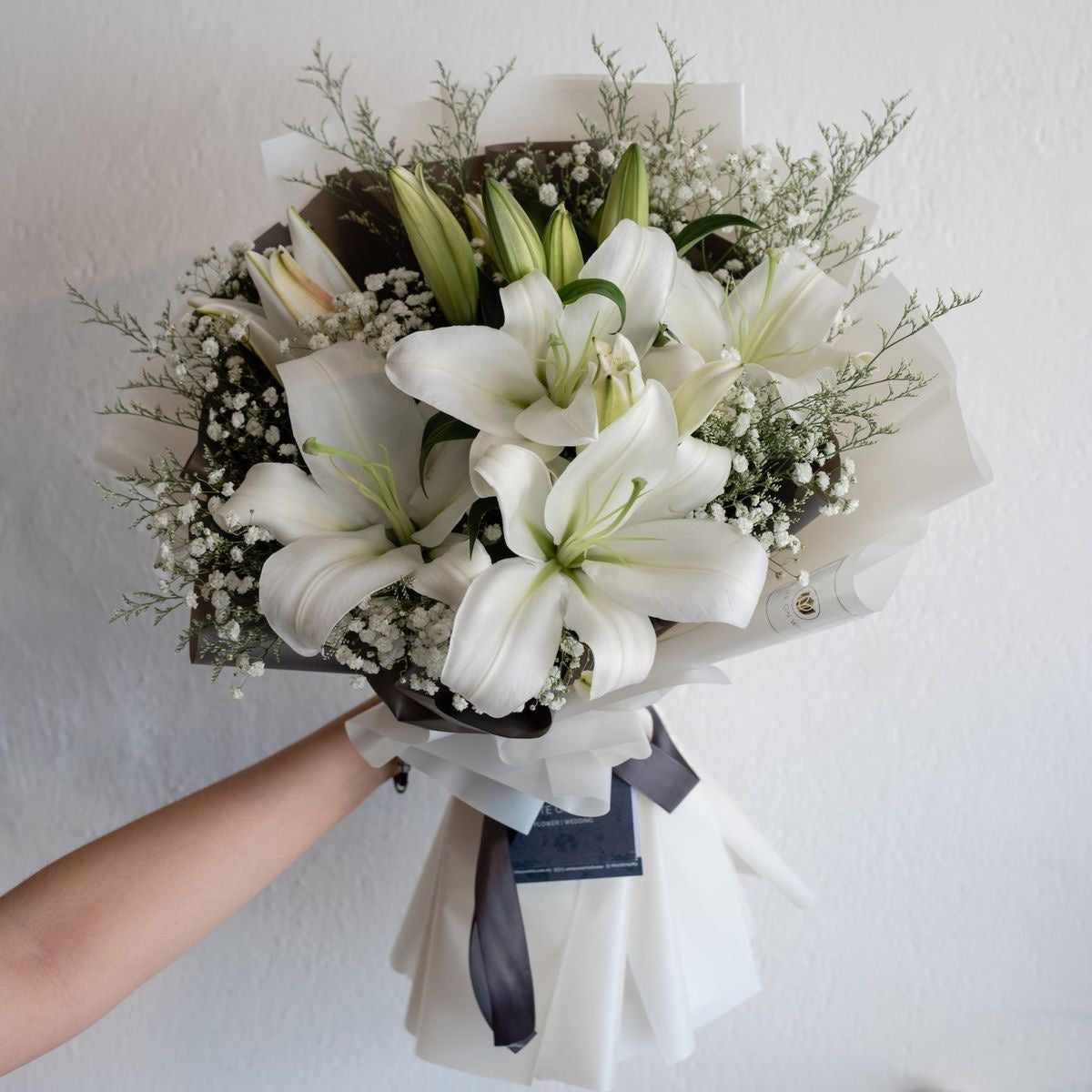 Classic. Elegant. Sophisticated. Our Korean wrapped lily bouquet brings all of these qualities to life, while bringing you closer to the people you love.
