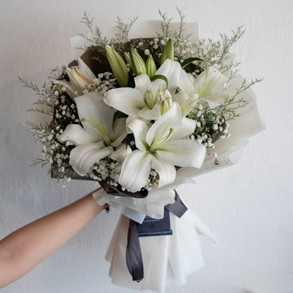 Classic. Elegant. Sophisticated. Our Korean wrapped lily bouquet brings all of these qualities to life, while bringing you closer to the people you love.