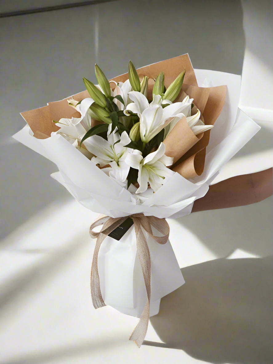 Classic. Elegant. Sophisticated. Our Korean wrapped lily bouquet brings all of these qualities to life, while bringing you closer to the people you love.