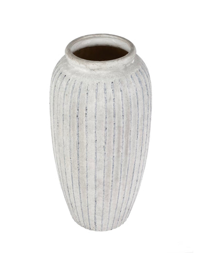 A ribbed ceramic vase with a textured, distressed off-white glaze and a dark brown interior, shown on a plain white background.